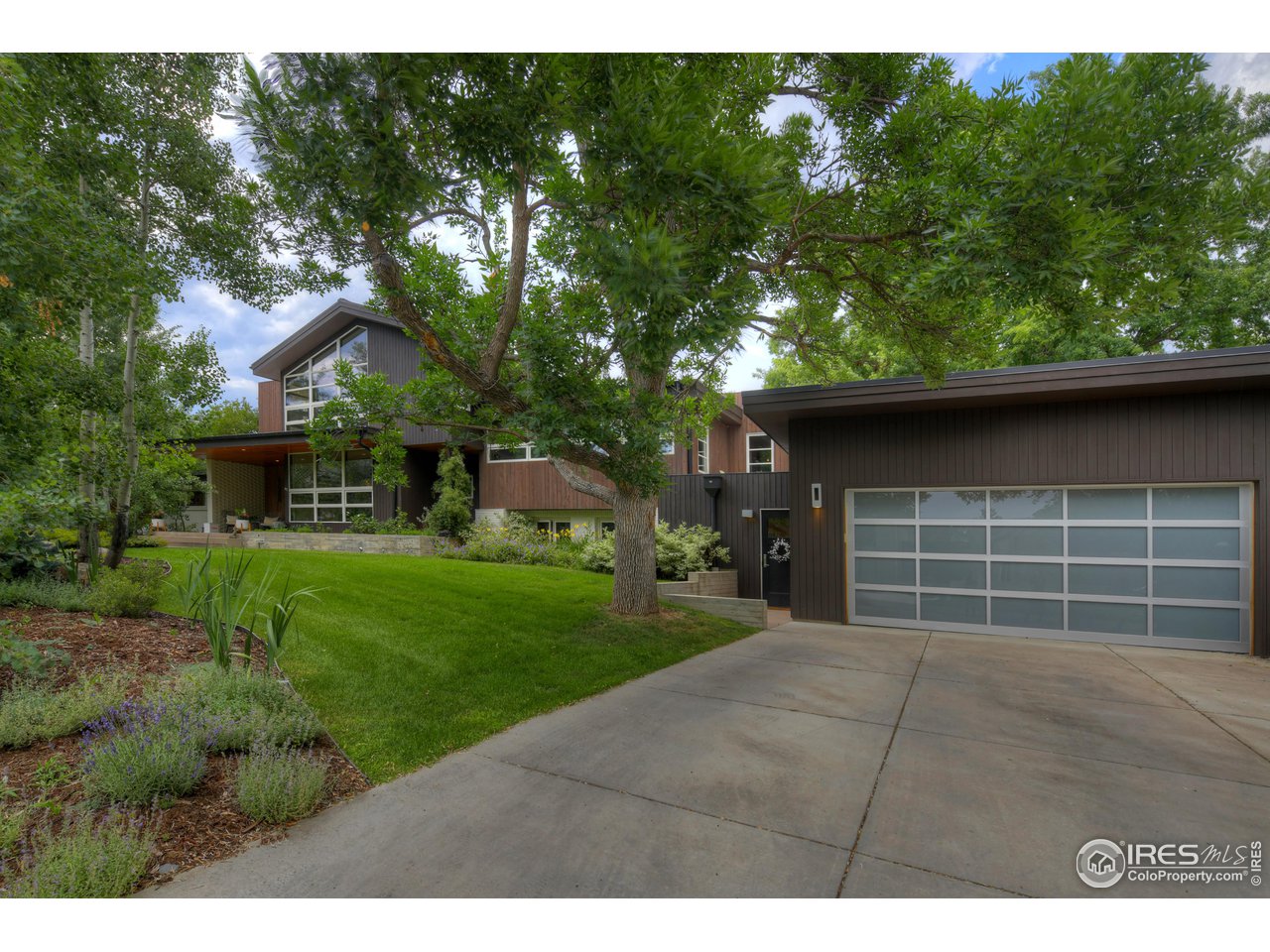 2115 Linden Avenue Boulder, CO 80304 - Photo 2 of 40 a house view with a garden space