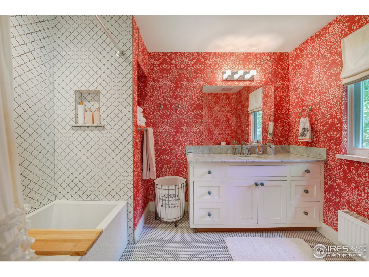 2115 Linden Avenue Boulder, CO 80304 - Photo 25 of 40 a bathroom with a tub sink and a mirror