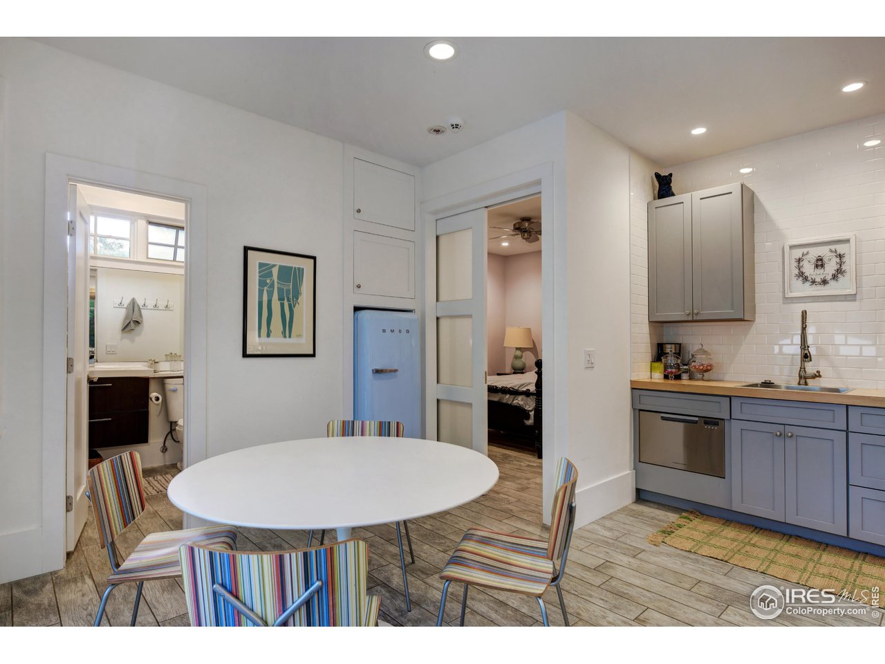 2115 Linden Avenue Boulder, CO 80304 - Photo 35 of 40 a kitchen with stainless steel appliances kitchen island granite countertop a sink refrigerator and microwave