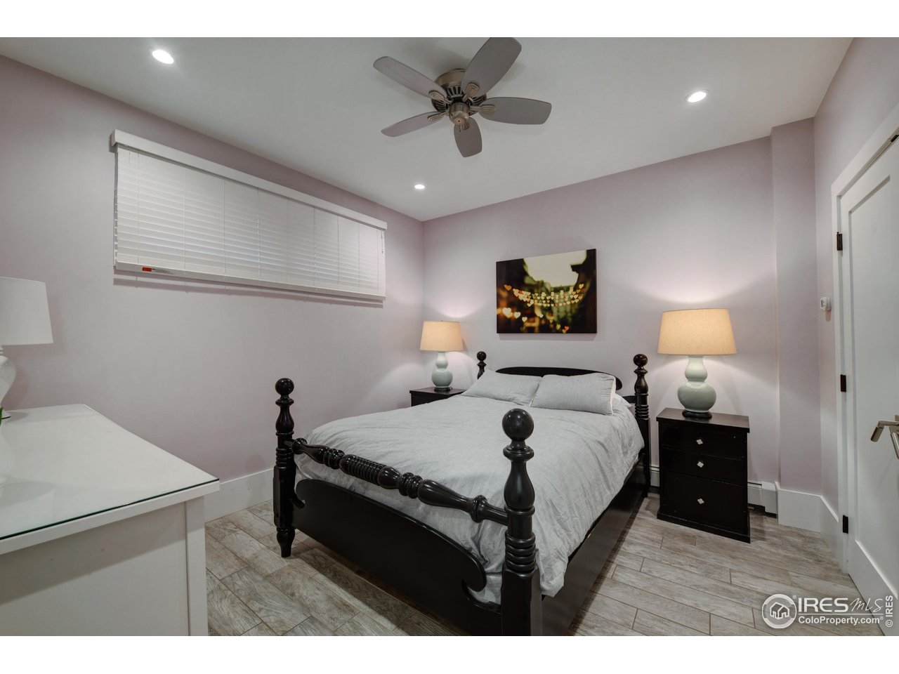 2115 Linden Avenue Boulder, CO 80304 - Photo 36 of 40 a bedroom with a bed and a chandelier