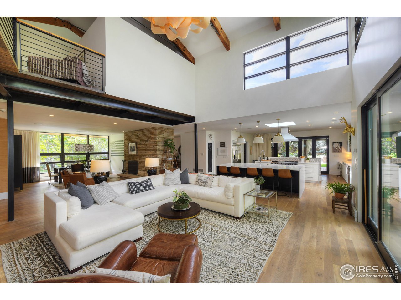 2115 Linden Avenue Boulder, CO 80304 - Photo 10 of 40 a living room with furniture and a large window