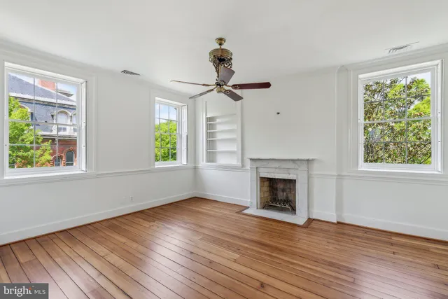 a kitchen with stainless steel appliances a refrigerator sink and cabinets