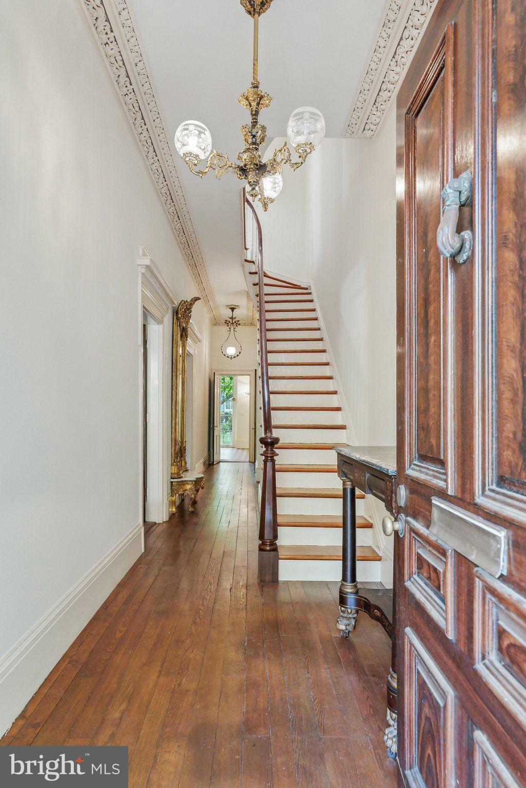 1527 35th Street Northwest Washington, DC 20007 - Photo 3 of 33 a view of a hallway with wooden floor and staircase