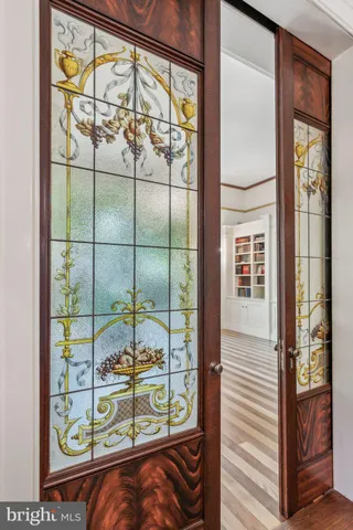 a view of a livingroom with wooden floor and chandelier