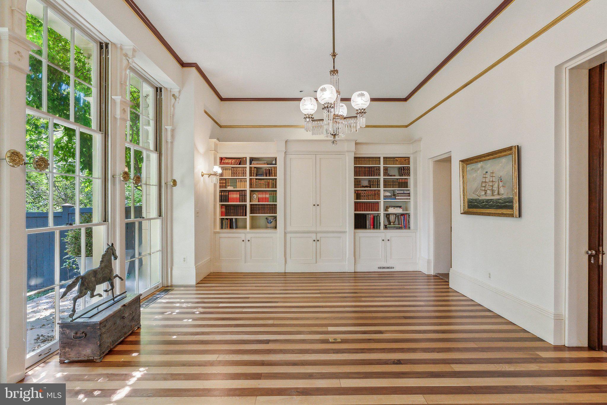1527 35th Street Northwest Washington, DC 20007 - Photo 7 of 33 a view of a livingroom with wooden floor and chandelier