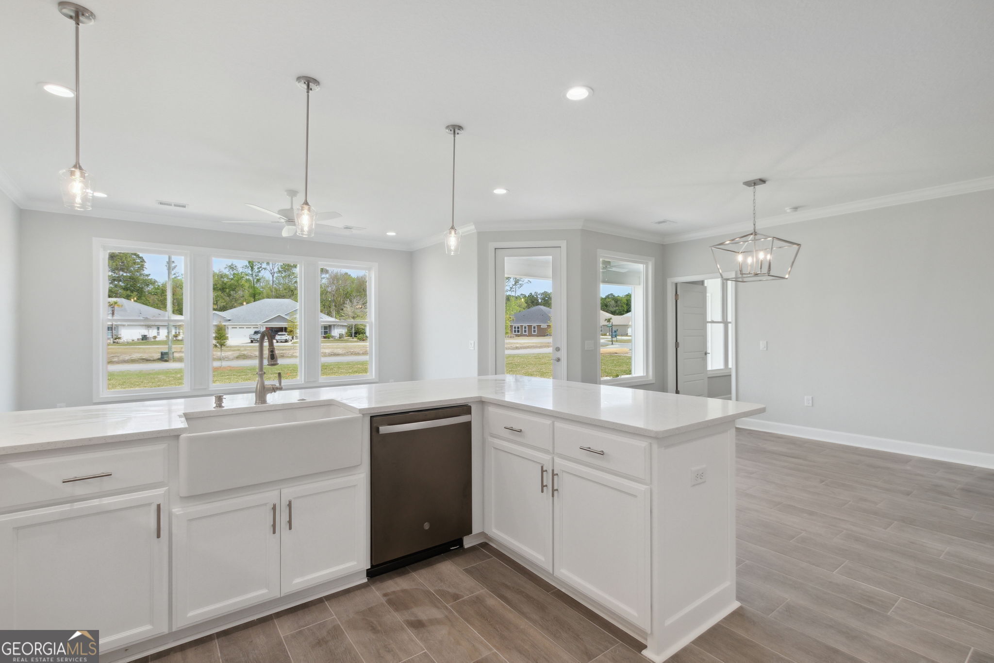 107 Green Turtle Court Kingsland, GA 31548 - Photo 13 of 39 a kitchen with white cabinets and sink