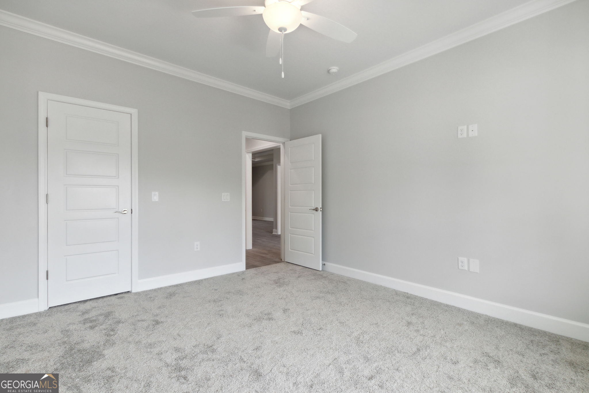 107 Green Turtle Court Kingsland, GA 31548 - Photo 27 of 39 an empty room with a chandelier fan and closet area