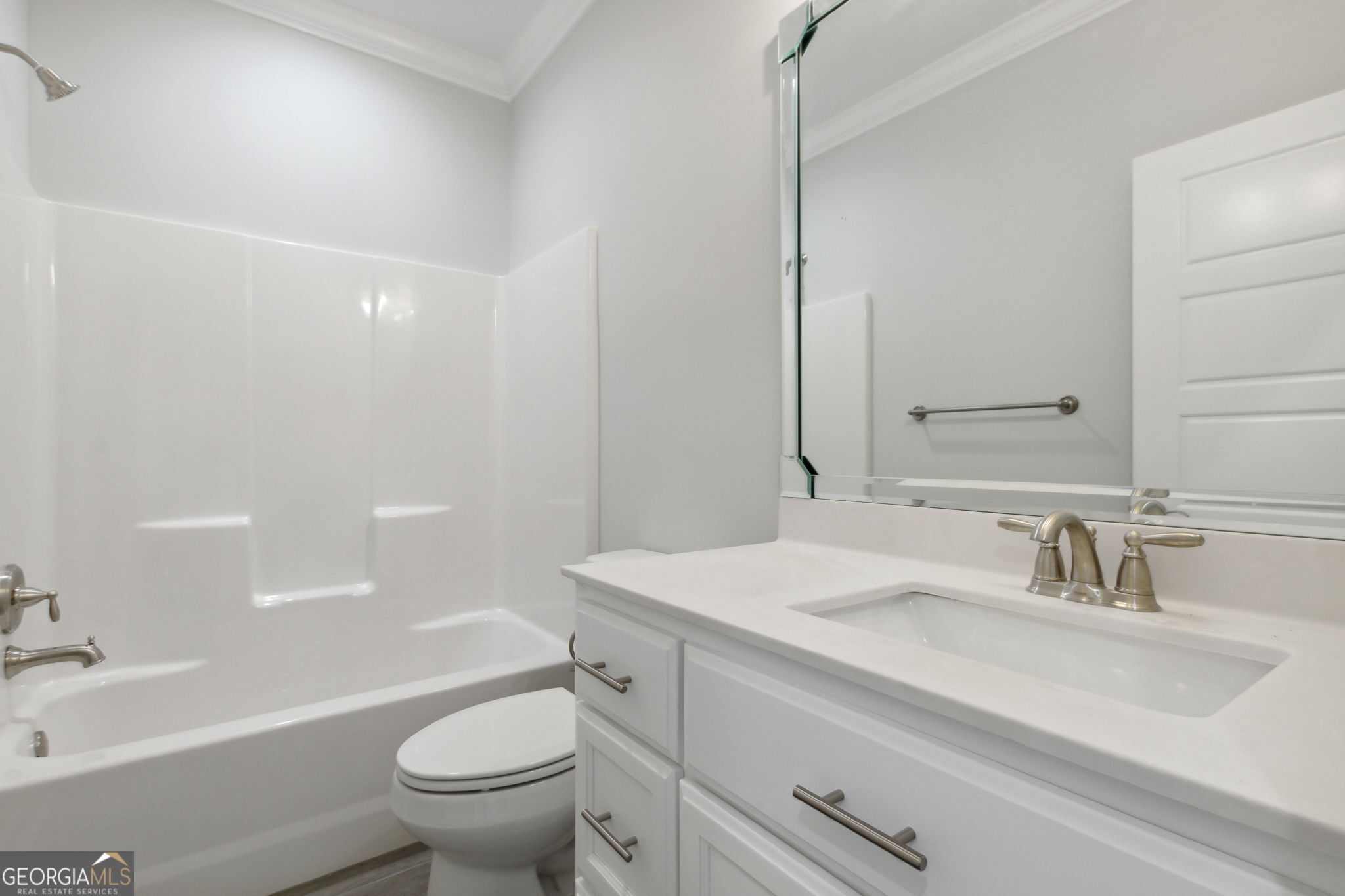 107 Green Turtle Court Kingsland, GA 31548 - Photo 28 of 39 a bathroom with a sink a toilet and a large mirror