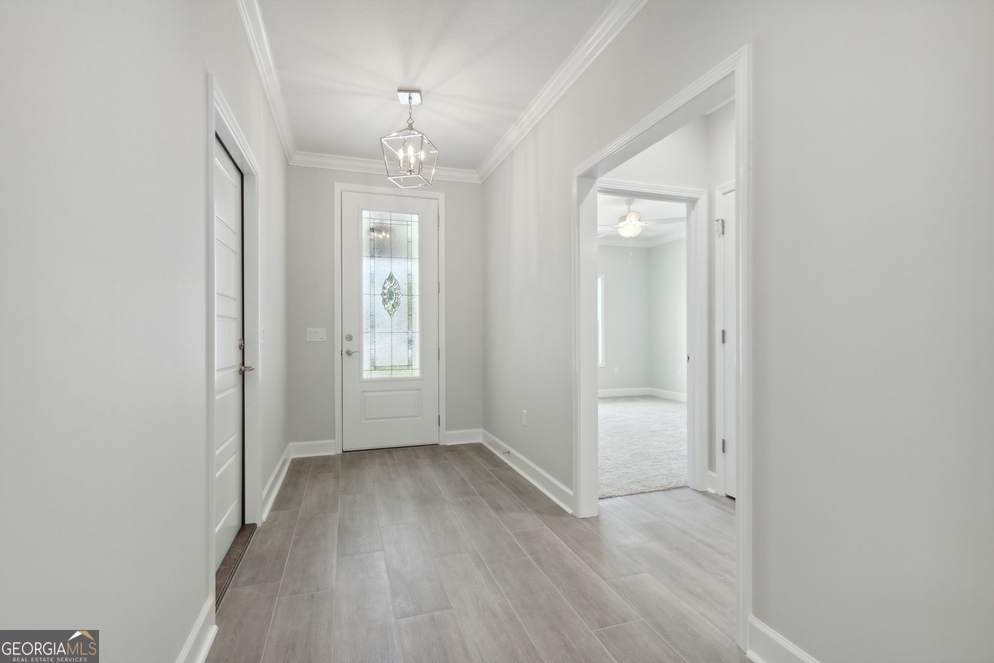 107 Green Turtle Court Kingsland, GA 31548 - Photo 3 of 39 wooden floor in an empty room with a window
