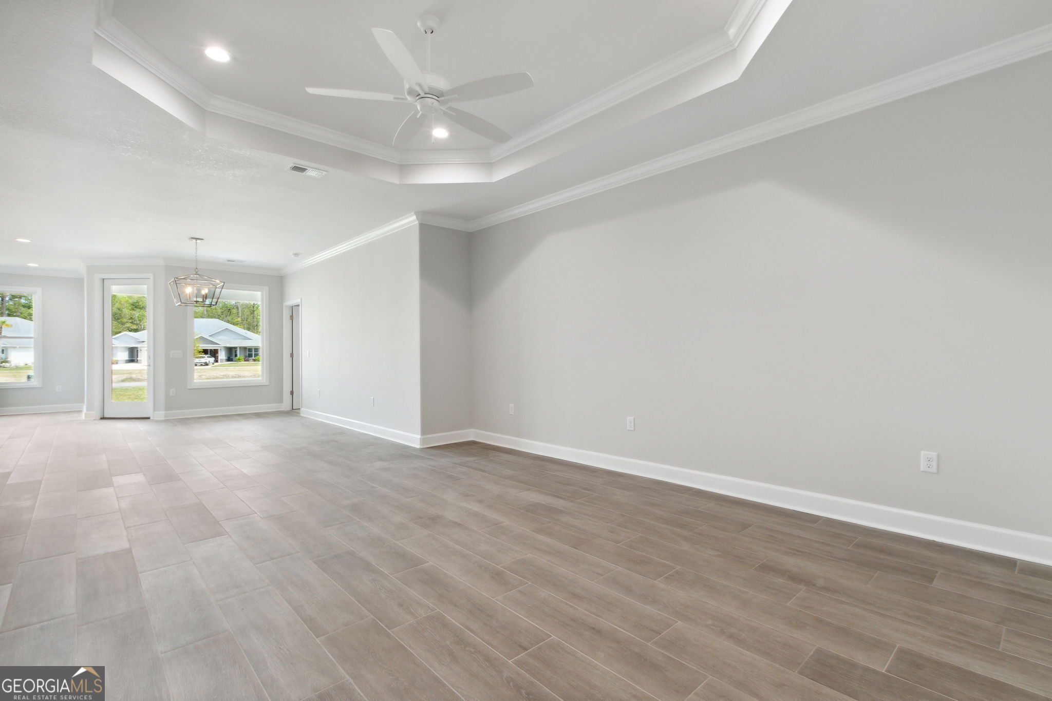 107 Green Turtle Court Kingsland, GA 31548 - Photo 4 of 39 wooden floor in an empty room with a window