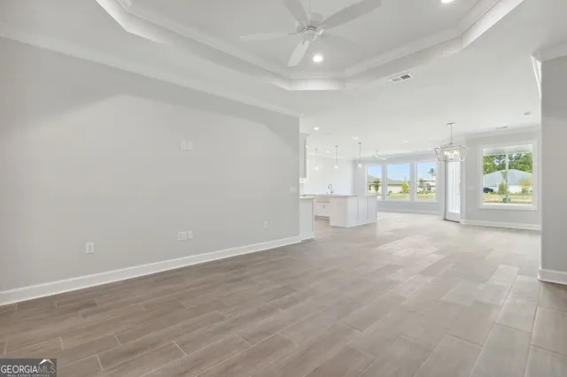 a view of a kitchen with refrigerator and a sink