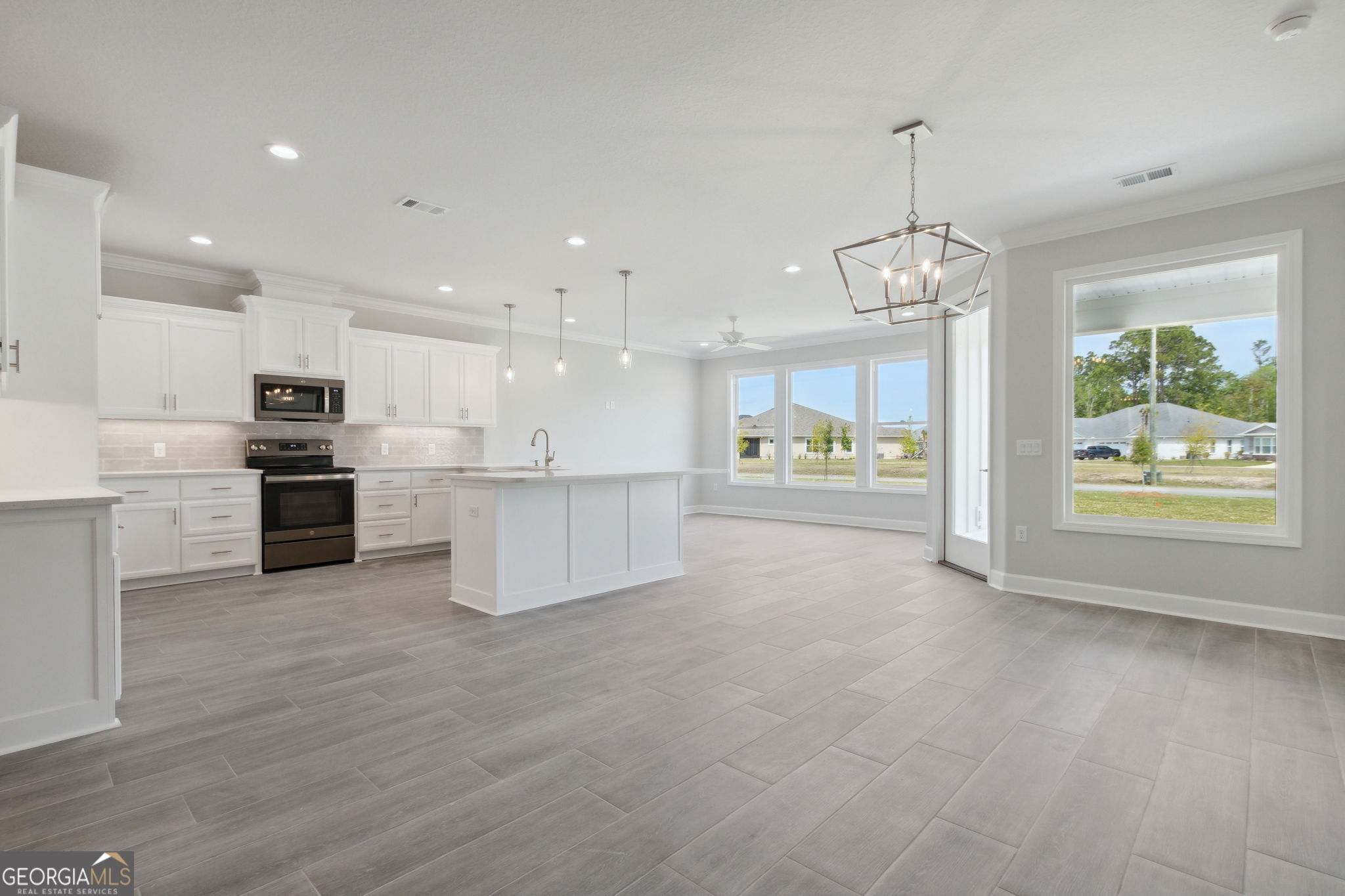 107 Green Turtle Court Kingsland, GA 31548 - Photo 9 of 39 a view of a kitchen with a sink and microwave