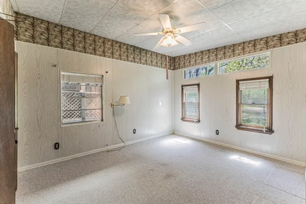 a view of an empty room with a window