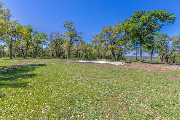 a view of outdoor space with trees all around
