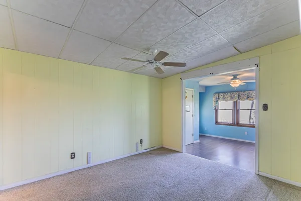 an empty room with a empty space and windows