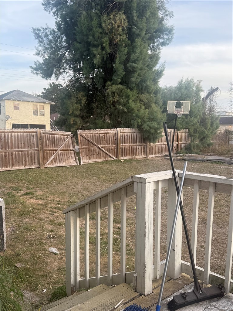 420 East 4th Street Alice, TX 78332 - Photo 18 of 28 a view of a house with a wooden deck