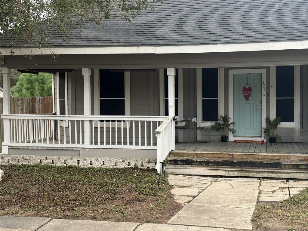 420 East 4th Street Alice, TX 78332 - Photo 2 of 28 a view of a house with a small yard and wooden floor and fence