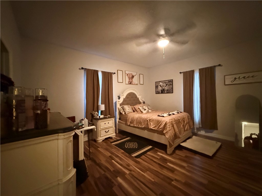 420 East 4th Street Alice, TX 78332 - Photo 25 of 28 a bed room with a bed and a lamp