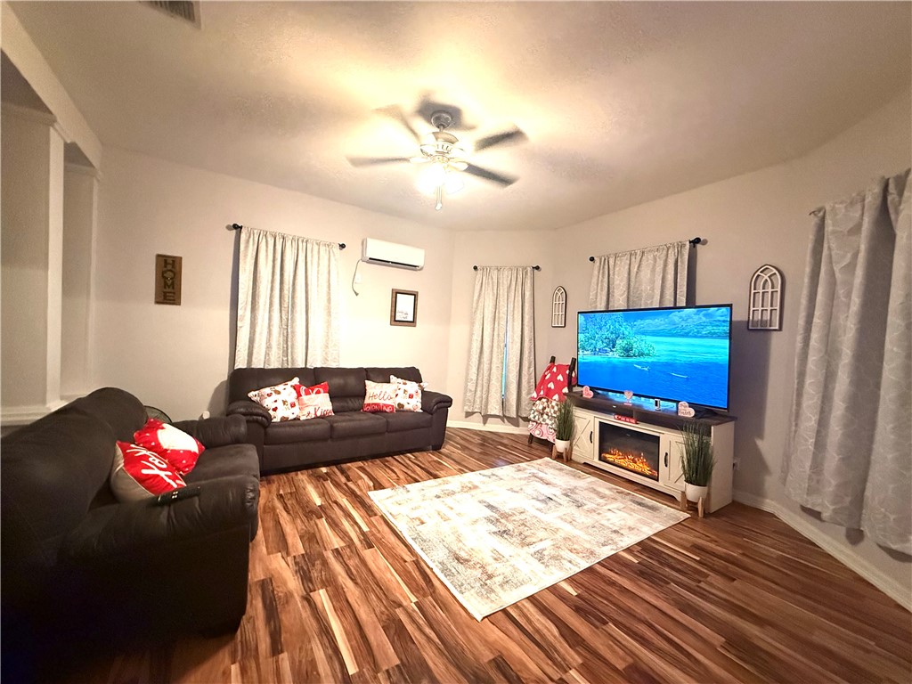 420 East 4th Street Alice, TX 78332 - Photo 6 of 28 a living room with furniture and a flat screen tv
