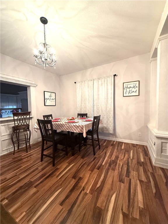 420 East 4th Street Alice, TX 78332 - Photo 9 of 28 a living room with a couch chairs and a dining table with wooden floor