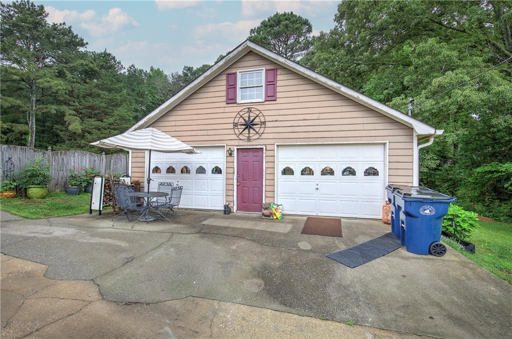 3637 Nebo Road Hiram, GA 30141 - Photo 7 of 63 a view of a house with a patio and a yard