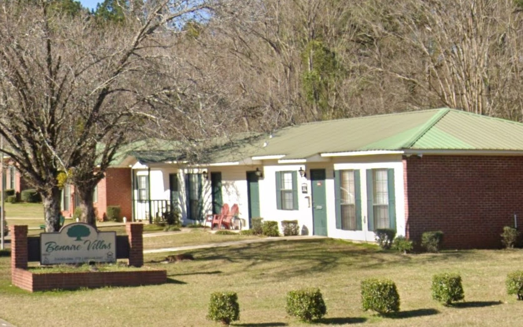 a swimming pool with outdoor seating and yard