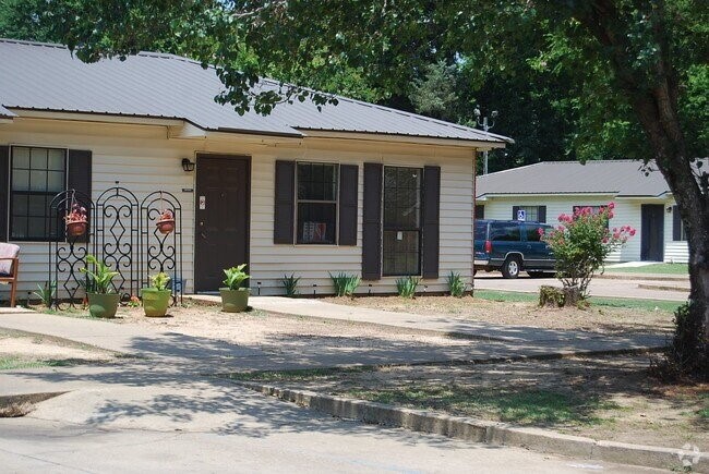 4191 Broad Street Other, AL 36769 - Photo 3 of 6 a patio with a table and chairs under an umbrella
