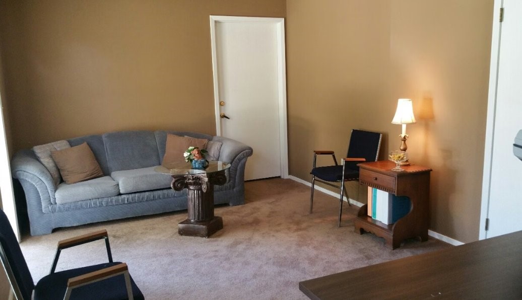 4191 Broad Street Other, AL 36769 - Photo 5 of 6 a living room with furniture a flat screen tv and a fireplace