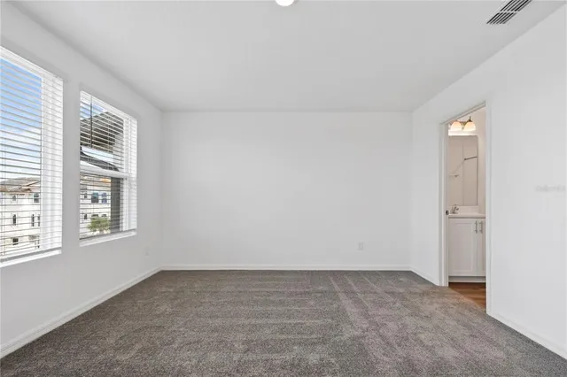 an empty room with windows