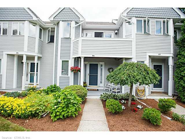 59 Old Post Road, Unit F6 Clinton, CT 06413 - Photo 1 of 1 a front view of a house with garden