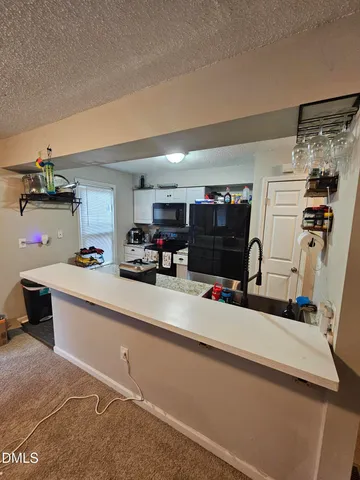 a bedroom with a bed and dresser