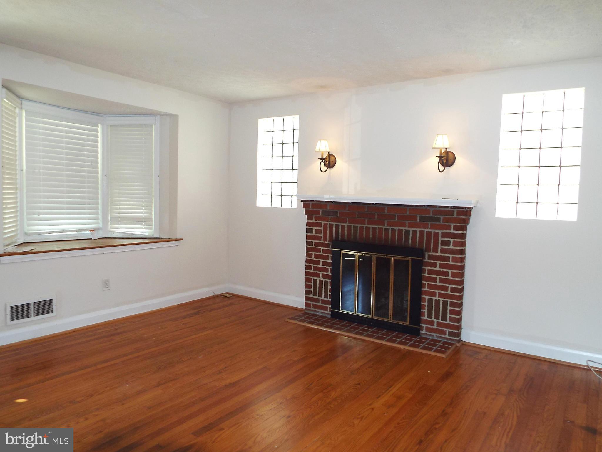 1634 Hardwick Road Baltimore, MD 21286 - Photo 4 of 24 LIVING ROOM W/ HDWD FLOORS AND FIREPLACE