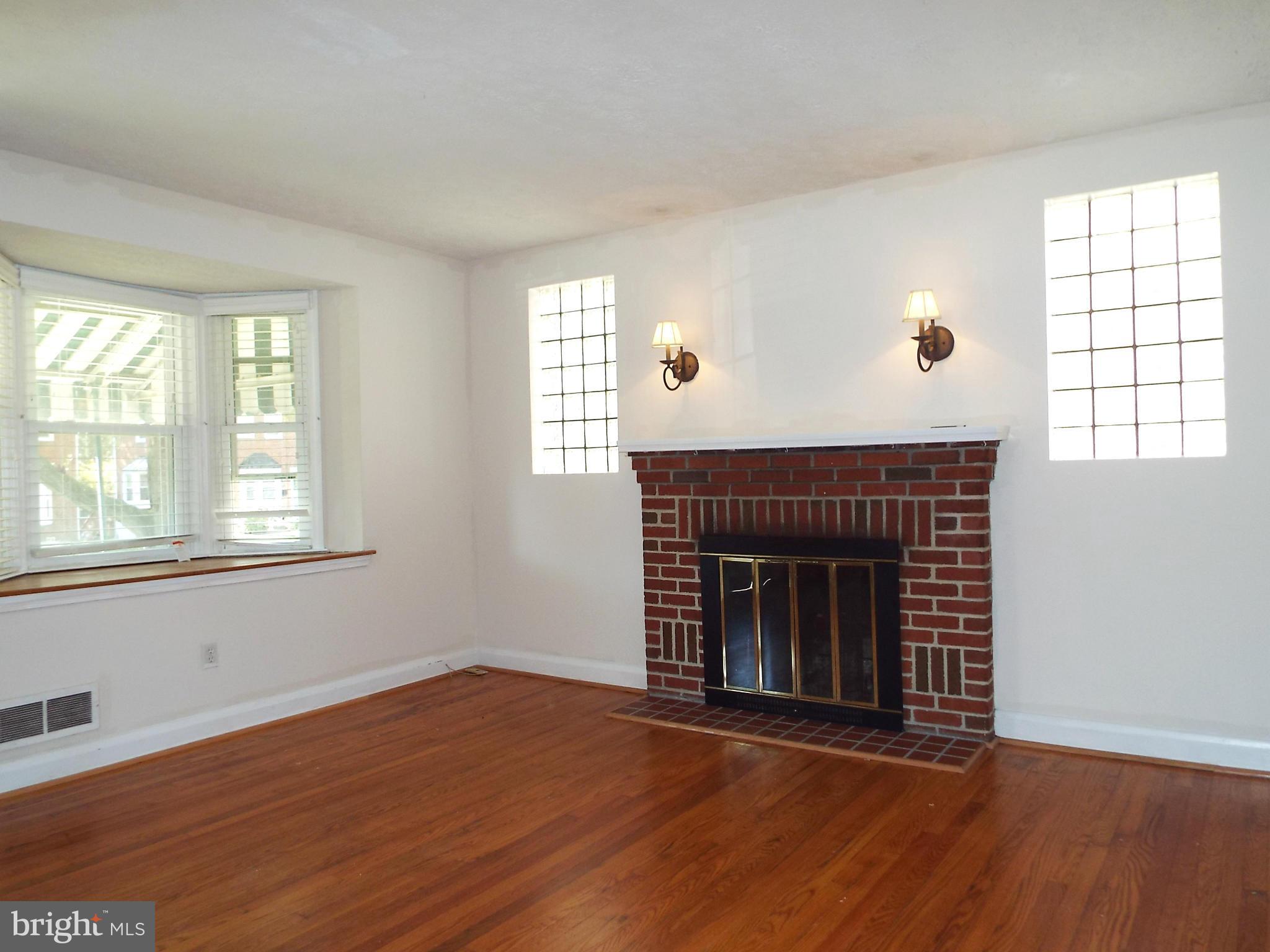 1634 Hardwick Road Baltimore, MD 21286 - Photo 7 of 24 LIVING ROOM W/ HDWD FLOORS AND FIREPLACE
