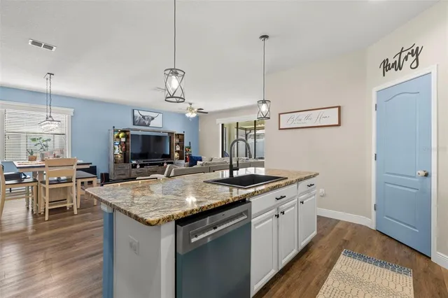 a kitchen with a sink stove and microwave