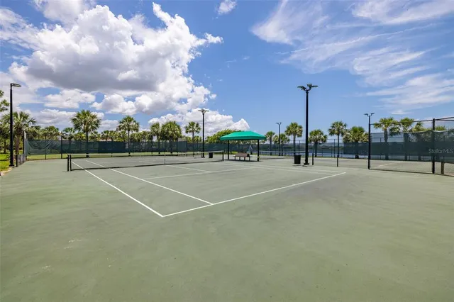 a swimming pool with outdoor seating and yard