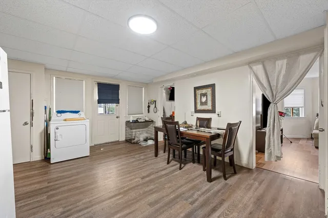 a view of a dining room with furniture and wooden floor