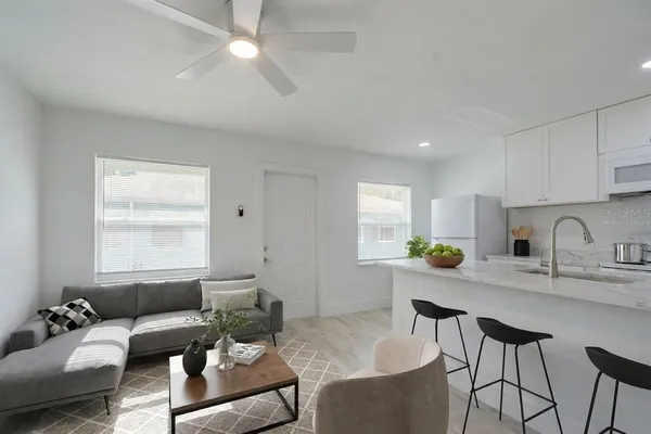 a living room with furniture and window