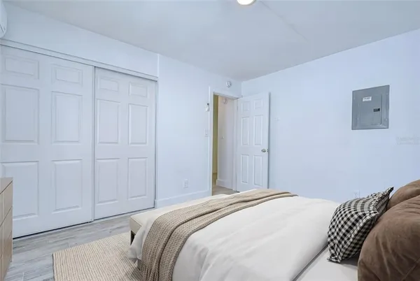 a bedroom with a bed and a shower