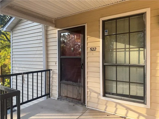 a view of a door and a window