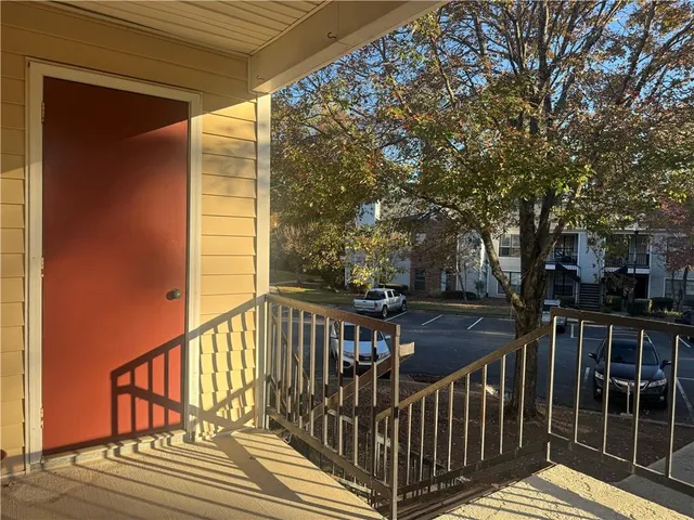 a view of a balcony with wooden floor