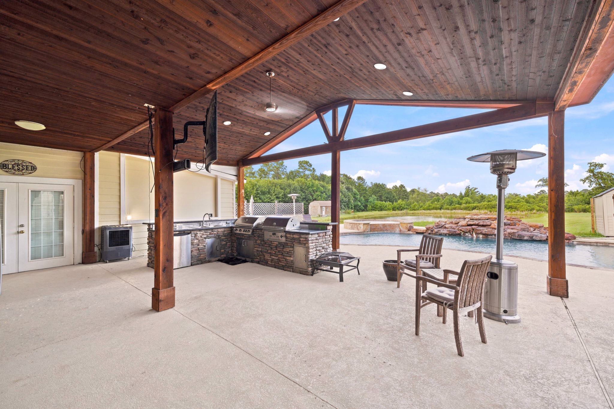 144 Wood Farm Road Huntsville, TX 77320 - Photo 35 of 50 a view of a swimming pool with outdoor seating