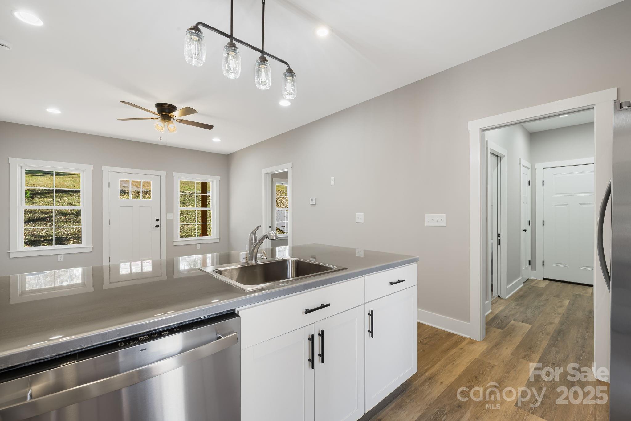129 Brentwood Road Morganton, NC 28655 - Photo 11 of 28 a kitchen with stainless steel appliances granite countertop a sink a counter space and a window