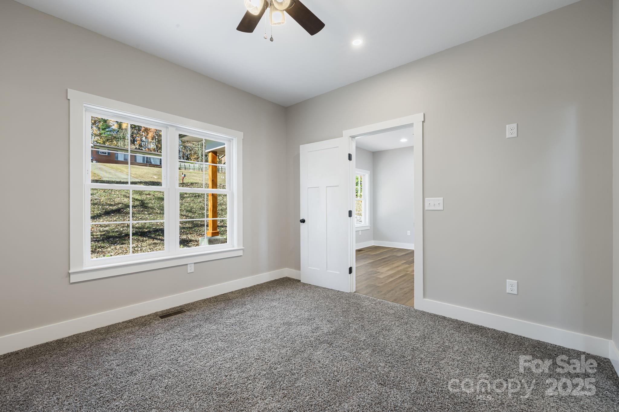 129 Brentwood Road Morganton, NC 28655 - Photo 14 of 28 an empty room with fan and windows
