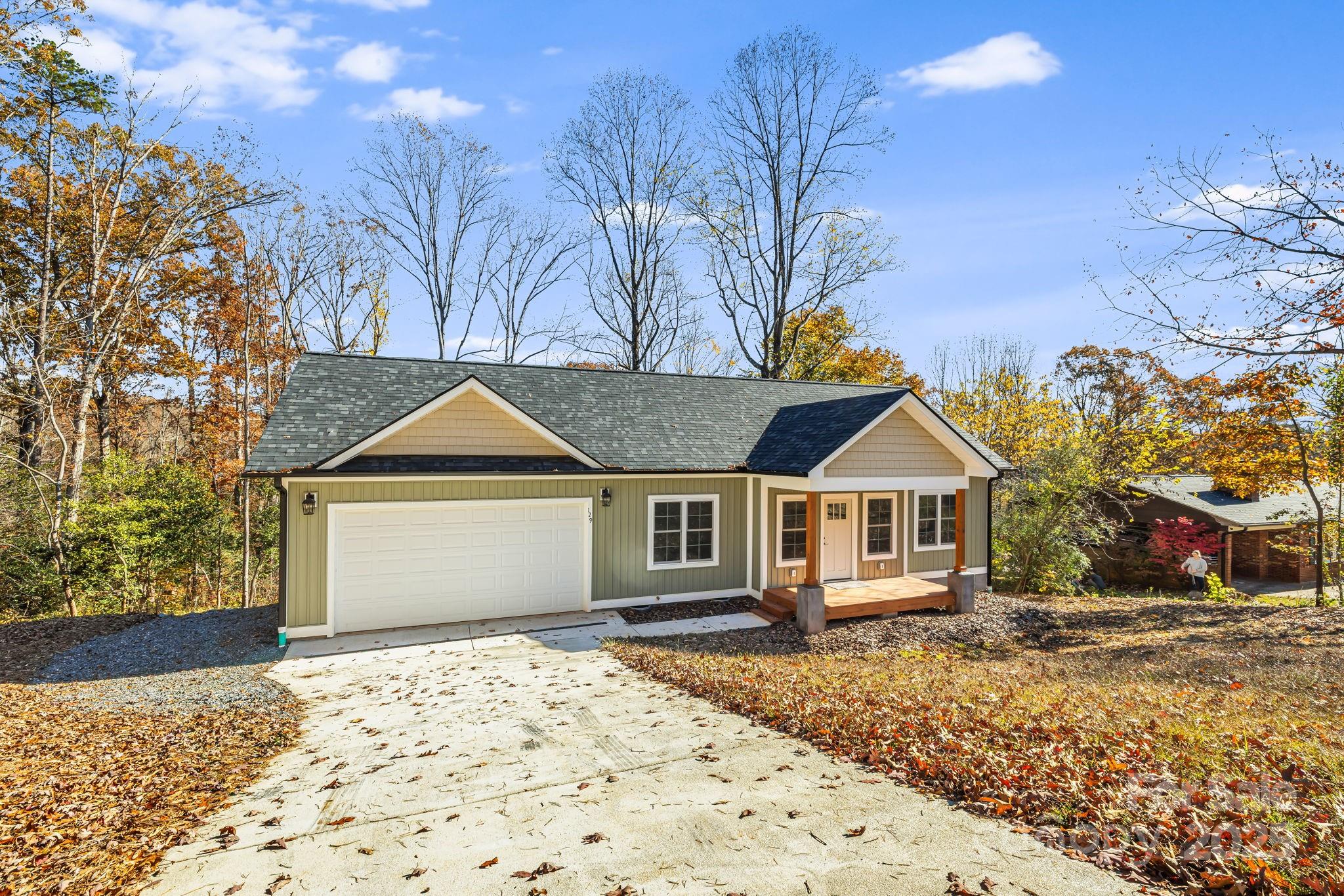 129 Brentwood Road Morganton, NC 28655 - Photo 2 of 28 a house with trees in the background