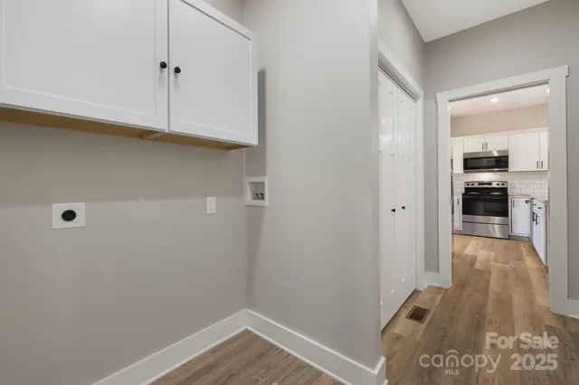 a view of a kitchen from the hallway