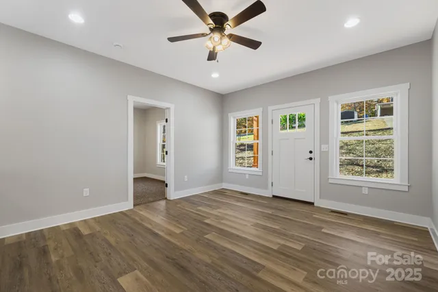 a view of an empty room with a window
