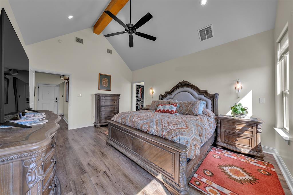 6628 Buffalo Ridge Circle Godley, TX 76044 - Photo 20 of 39 a bedroom with a bed and a flat tv screen on the dresser