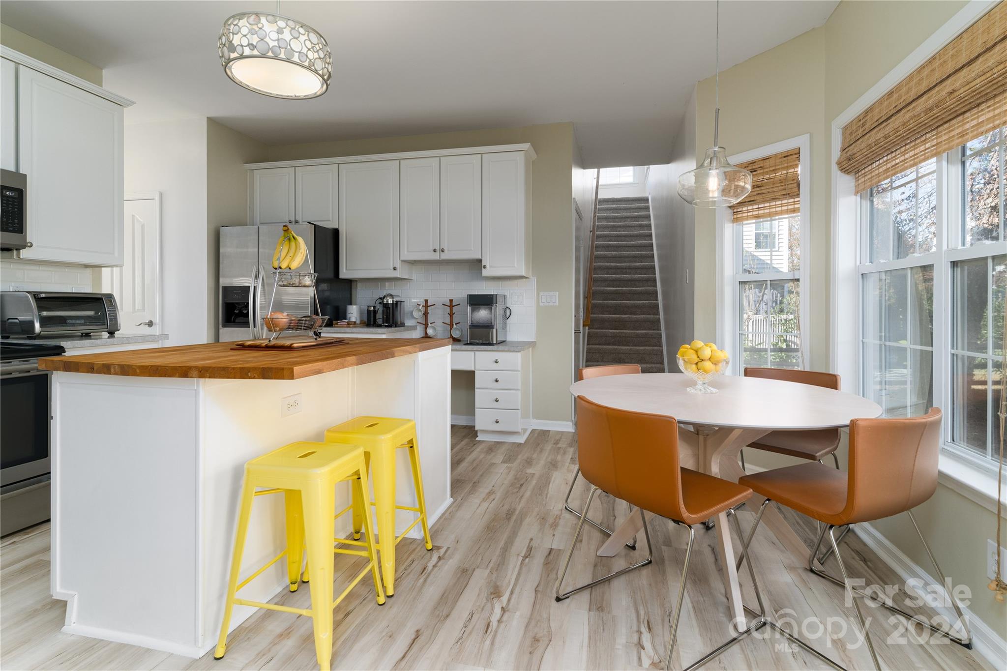 9427 Culcairn Road Huntersville, NC 28078 - Photo 14 of 39 a view of a dining room with furniture and a kitchen