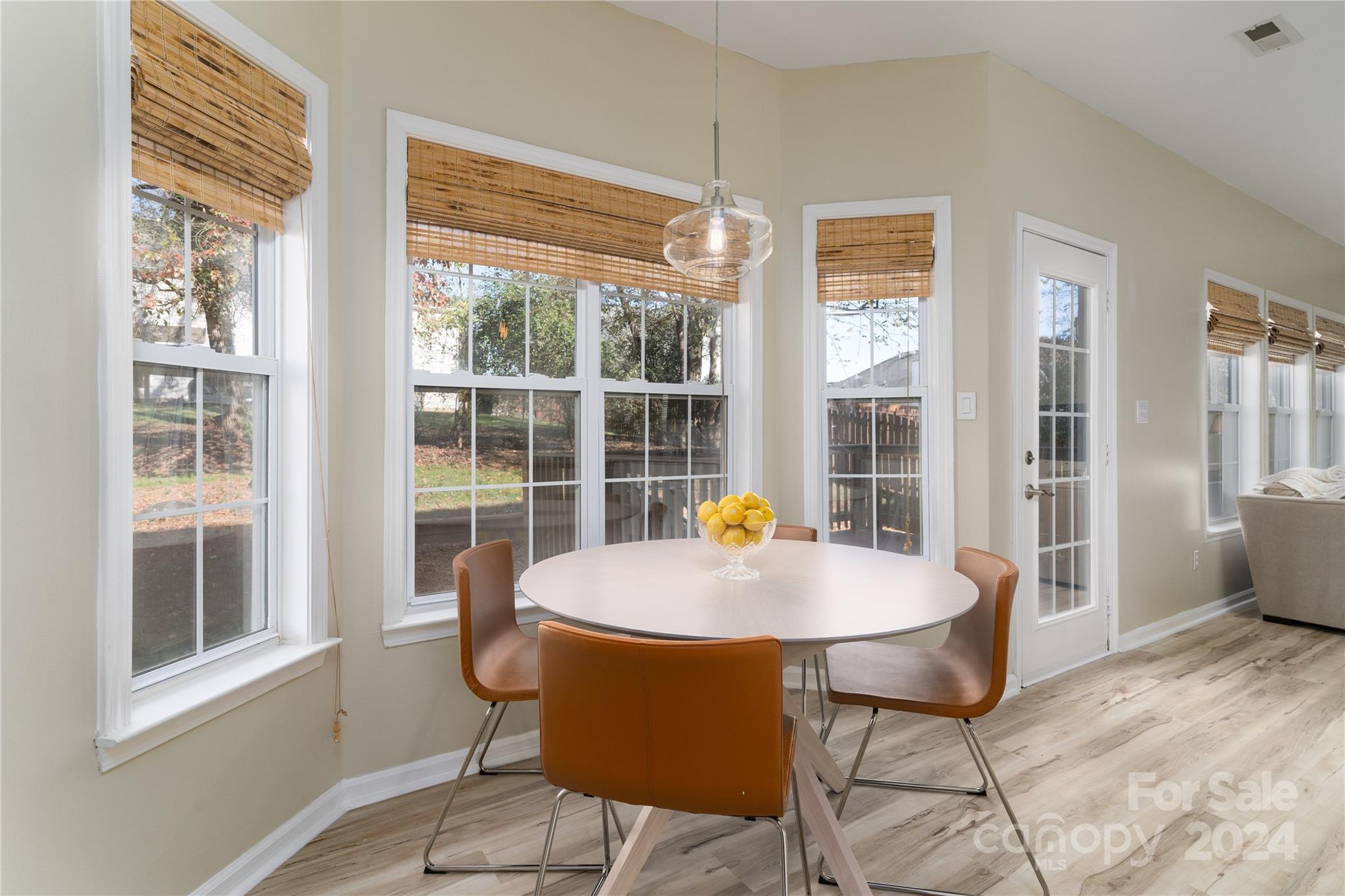 9427 Culcairn Road Huntersville, NC 28078 - Photo 15 of 39 a living room with a table and chairs