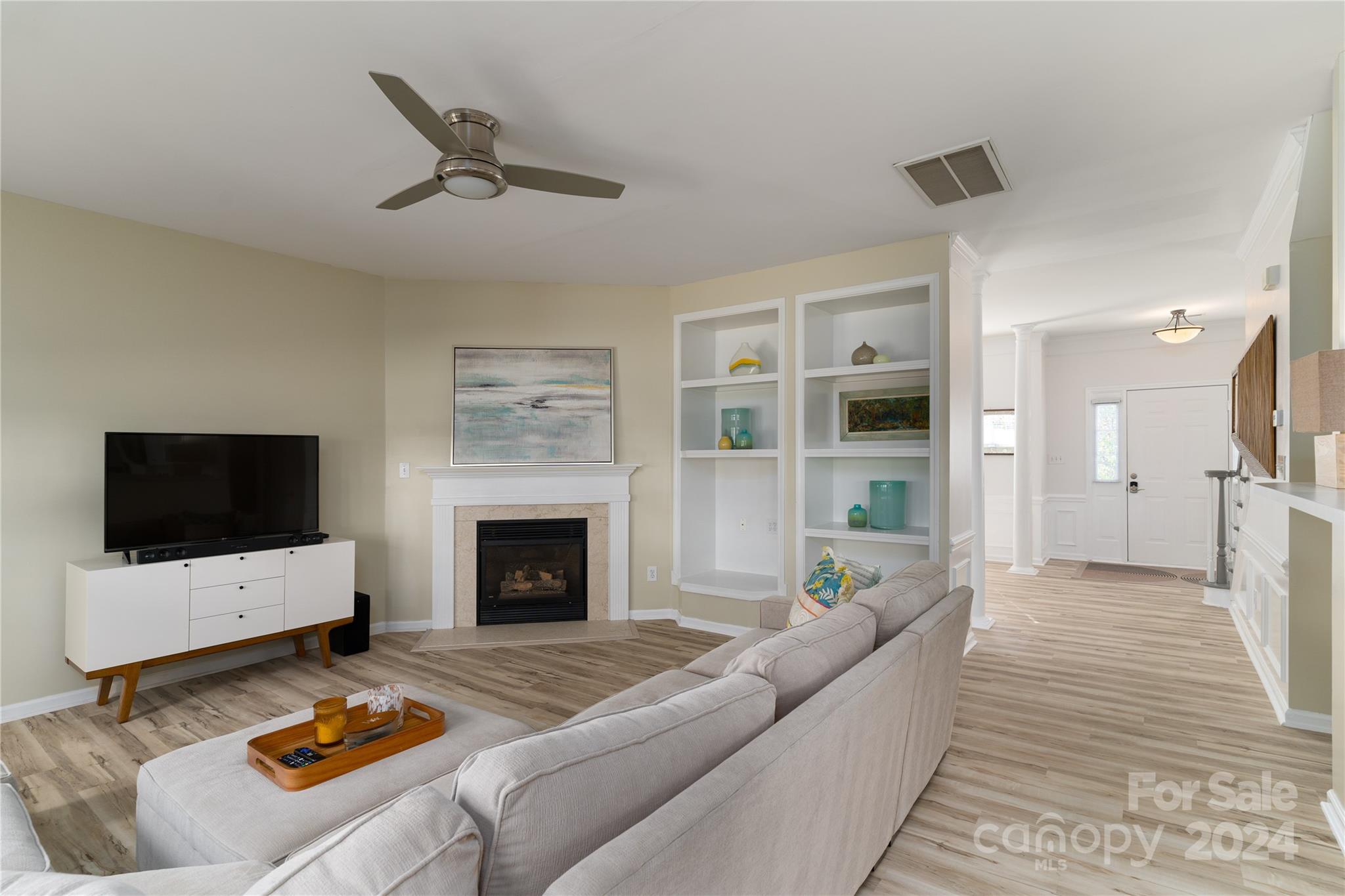 9427 Culcairn Road Huntersville, NC 28078 - Photo 16 of 39 a living room with furniture and a fireplace